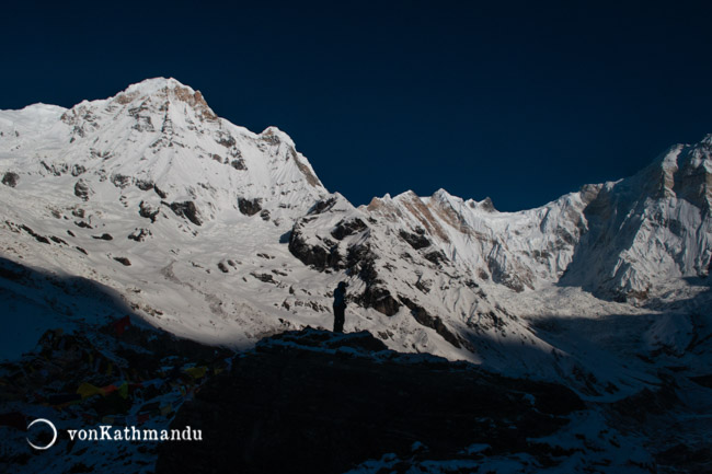 Silhouetted against glistening Annapurnas