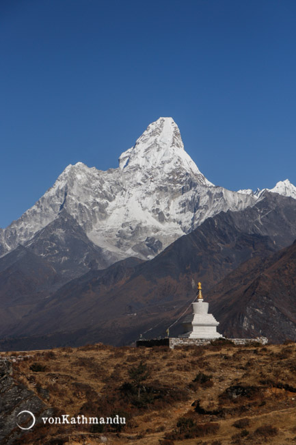 Chhorten, a Buddhist monument, seemingly mimics the color and shape of Ama Dablam
