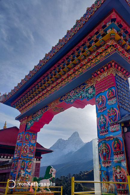 Ama Dablam seen through the ornately decorated gate of Tengboche Monastery