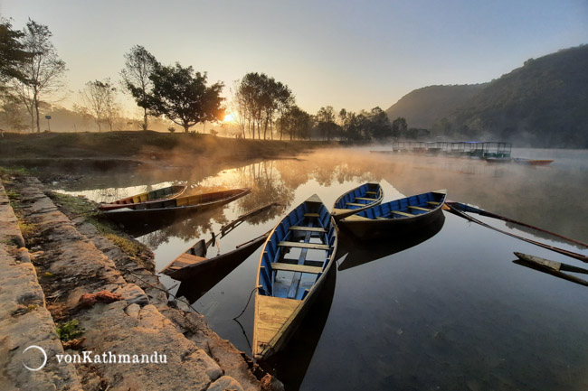 Boats on Phewa Lake, steaming under the morning sun