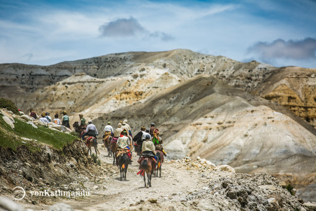 Horsemen galloping from Lo Manthang to Chhoser in Upper Mustang