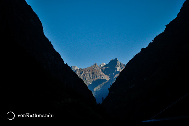 Tal village is set on a narrow valley with jagged rocky formations on the horizon