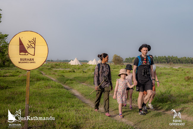 Naturalist taking a family on a guided wildlife tracking activity around Burhan camps