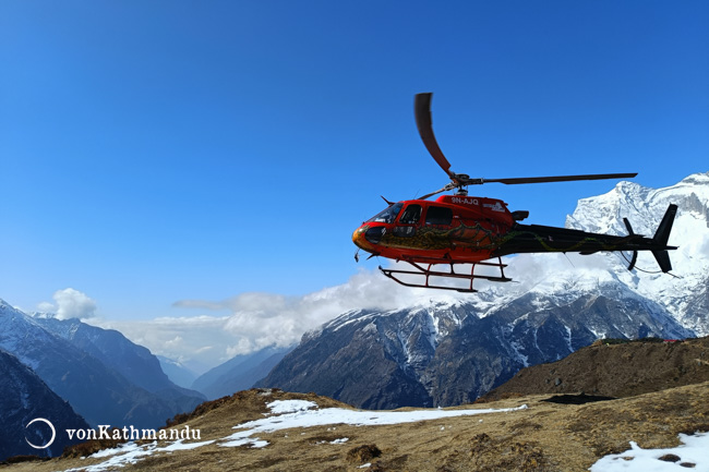 The take off from the Syangboche helipad with patches of snow