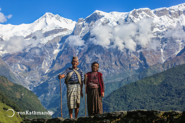 A Gurung couple in front of Annapurna mountains