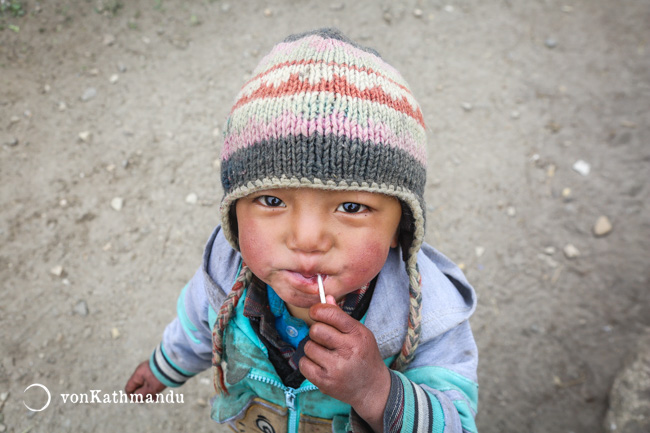 Little Sherpa kid. Cold wind and low moisture leads to rosy red cheeks in highlands