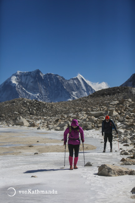 Walking on a frozen lake near Larke Pass