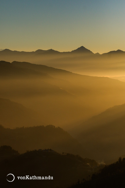 Vibrant yellow morning in the valley and hills of Jhapre