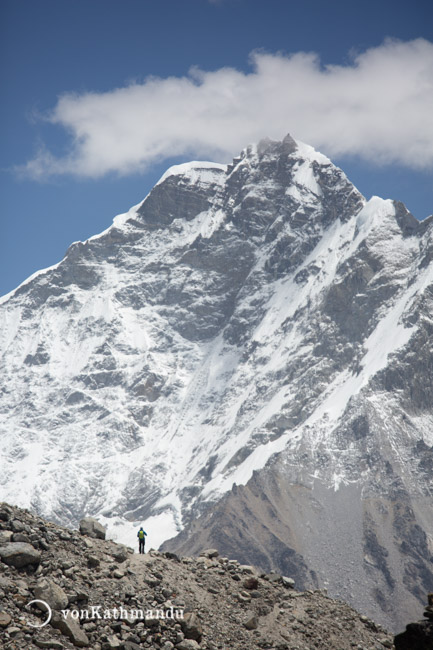 Giant mountains tower over you in all directions as you walk along Khumbu glacier