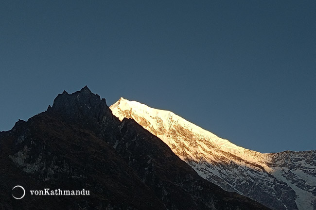 First rays of sun over Langtang Lirung mountain range