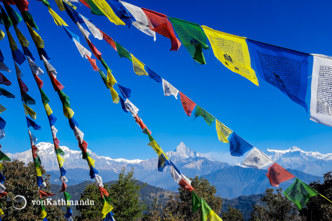 Colorful Buddhist prayer flags, called Lungta, are hung outdoors so that winds carry the prayers to everyone