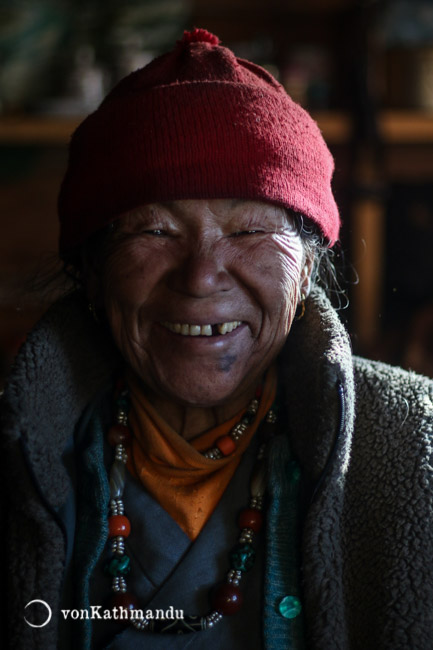 A smiley lady in Pikey Peak Base Camp ready to serve you dalbhat and stories