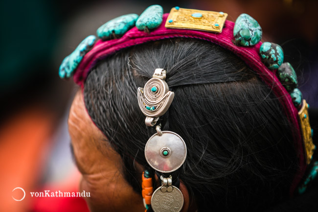 Tibetan ornaments worn by a local at a festival