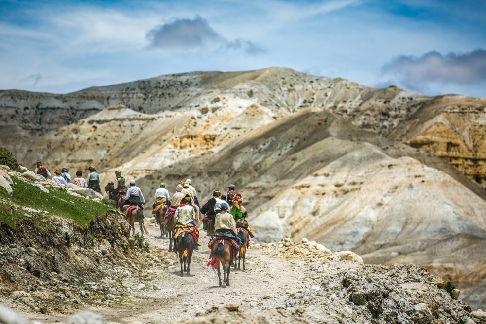 Horsemen galloping from Lo Manthang to Chhoser in Upper Mustang